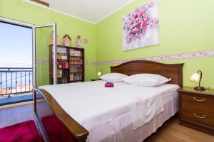 Posteľ alebo postele v izbe v ubytovaní Apartmani MM