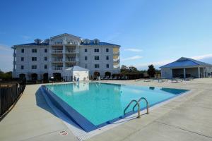 a large swimming pool in front of a building at Waterside Resort by Capital Vacations in Edenton
