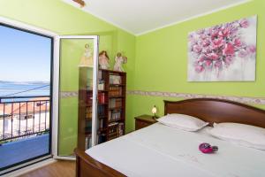 Posteľ alebo postele v izbe v ubytovaní Apartmani MM