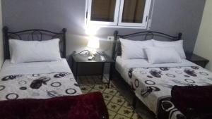 Uma cama ou camas num quarto em Gite porte oasis