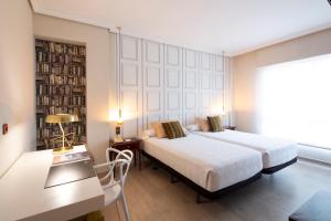 Säng eller sängar i ett rum på Hotel Ciudad de Vigo