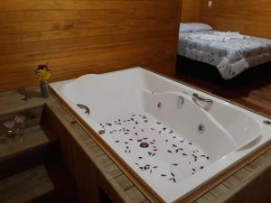 Postel nebo postele na pokoji v ubytování Pousada rio canoas
