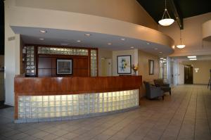 a lobby of a hospital with a reception counter at Coronet Hotel in Prince Albert