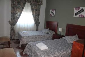 Ένα ή περισσότερα κρεβάτια σε δωμάτιο στο Villa La Quinta +40 φωτογραφίες