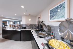 a kitchen with a counter with food on it at Rockland Harbor Hotel in Rockland