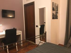 TV a/nebo společenská místnost v ubytování Holiday Rooms Portale Pirrera