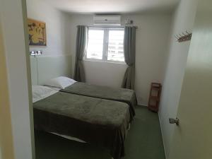 A bed or beds in a room at Heliemar