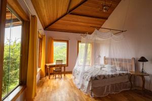 Ένα ή περισσότερα κρεβάτια σε δωμάτιο στο Altamira Eco Retreat