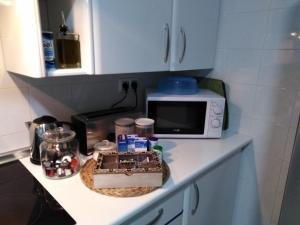 A kitchen or kitchenette at BeHouse Avenida