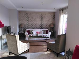 A seating area at BeHouse Avenida