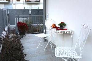 a small table and chairs on a patio at DB Apartments - Dabasso in Mestre