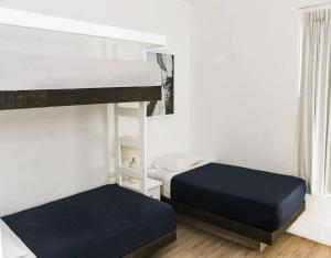 Cama ou camas em um quarto em Casa Paracas