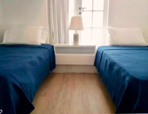 Cama ou camas em um quarto em Casa Paracas