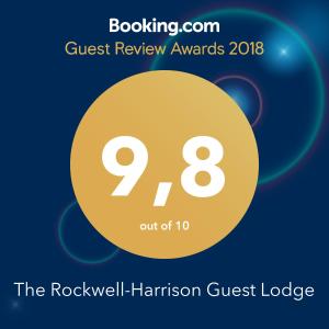 um logótipo para o alojamento de turismo selvagem Rockwell Harrington em The Rockwell-Harrison Guest Lodge em Harrison Hot Springs