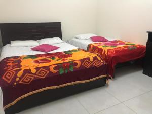 Krevet ili kreveti u jedinici u okviru objekta Hotel Maxim