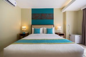 Postel nebo postele na pokoji v ubytování Boracay Haven Resort