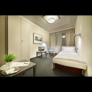 Posteľ alebo postele v izbe v ubytovaní Retro Hotel Kladno