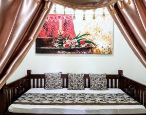 Letto o letti in una camera di nDalem Gamelan