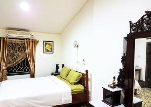 Letto o letti in una camera di nDalem Gamelan