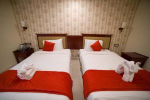 Postel nebo postele na pokoji v ubytování Hotel President
