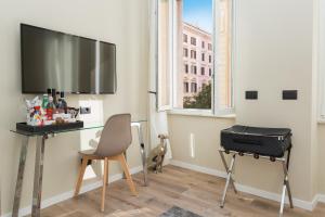 TV a/nebo společenská místnost v ubytování 126 Gracchi Suites