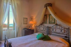 Łóżko lub łóżka w pokoju w obiekcie Hotel Villa Ottone