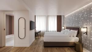 ein Hotelzimmer mit 2 Betten und einem Spiegel in der Unterkunft Hotel Walhalla in St. Gallen