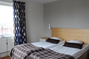 Letto o letti in una camera di Hotell Åsen