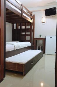 Krevet ili kreveti u jedinici u okviru objekta Blue Paseo Grande Inn