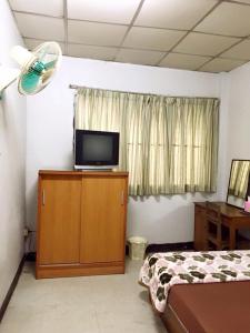 TV a/nebo společenská místnost v ubytování Tapae Inn Hotel