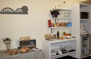 a kitchen with a counter with food on it at Hotel Malecon in O Barco de Valdeorras