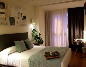Voodi või voodid majutusasutuse Hotel Malecon toas