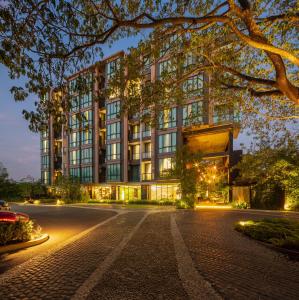 a building with a street in front of it at Parc Borough City Resort in Chiang Mai +101 photos