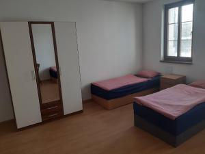 Postel nebo postele na pokoji v ubytování Penzion V Zatáčce