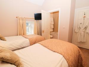 Voodi või voodid majutusasutuse Granary Barn toas