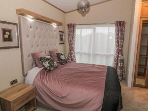 Ένα ή περισσότερα κρεβάτια σε δωμάτιο στο Avonal Lodge 24