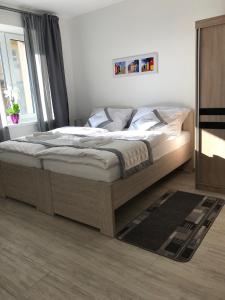 Posteľ alebo postele v izbe v ubytovaní Panorama Apartments