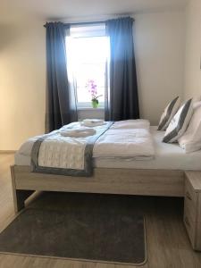 Posteľ alebo postele v izbe v ubytovaní Panorama Apartments
