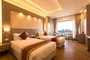 Letto o letti in una camera di Landmark Kathmandu