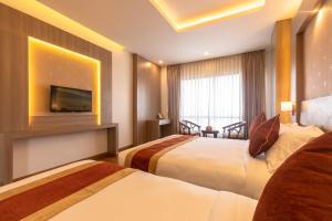 Letto o letti in una camera di Landmark Kathmandu