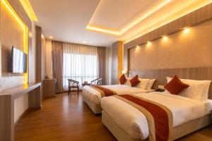 Letto o letti in una camera di Landmark Kathmandu