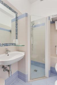 a bathroom with a sink and a shower at Hotel Silver in Milano Marittima