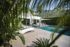 a villa with a swimming pool and a house at Villa Corallo in Cinisi
