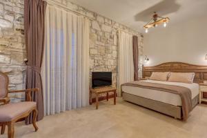 Кровать или кровати в номере Navalia Hotel