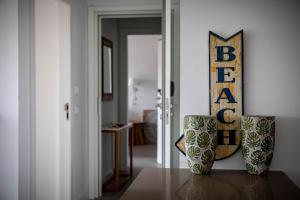 a room with two vases sitting on a table at Pestana Troia Eco-Resort & Residences in Troia