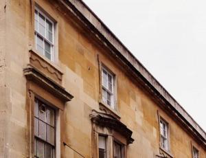 an old building with windows on the side of it at The Art Apartment in Bath