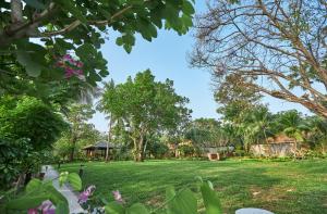 a view of a park with trees and grass at Bandara Spa Resort & Pool Villas, Samui in Bophut