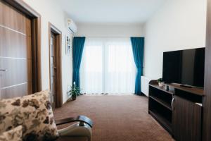 TV a/nebo společenská místnost v ubytování Páva Pension & Spa