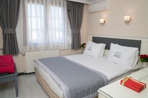 Una cama o camas en una habitación de Hotel Agan Oldcity Istanbul