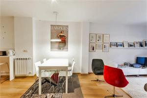 a dining room with a white table and chairs at ATERIAN PELAIO ETXEA in Getaria